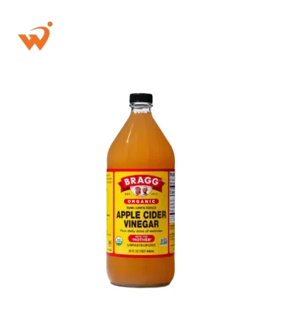 Bragg Organic Apple Cider Vinegar 473ml glass bottle with the iconic yellow and red label, showing the natural "Mother" sediment at the bottom.