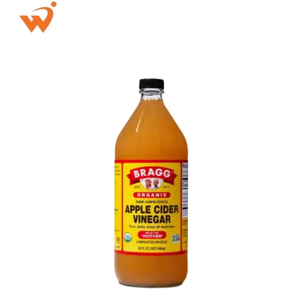 Bragg Organic Apple Cider Vinegar 473ml glass bottle with the iconic yellow and red label, showing the natural "Mother" sediment at the bottom.