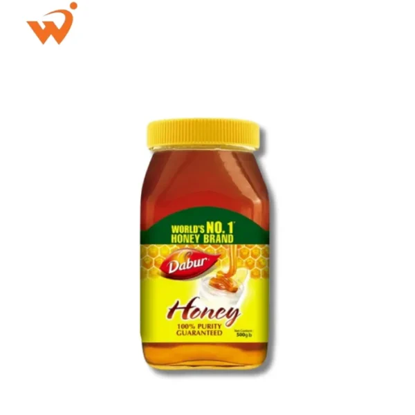 Dabur Honey 500gm medium-sized glass jar featuring the iconic Dabur branding and a clear view of the deep amber-colored honey.
