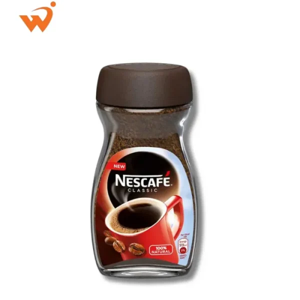 Nescafe Classic 100gm glass jar featuring the signature red mug, dark roasted coffee beans, and rich brown granules.